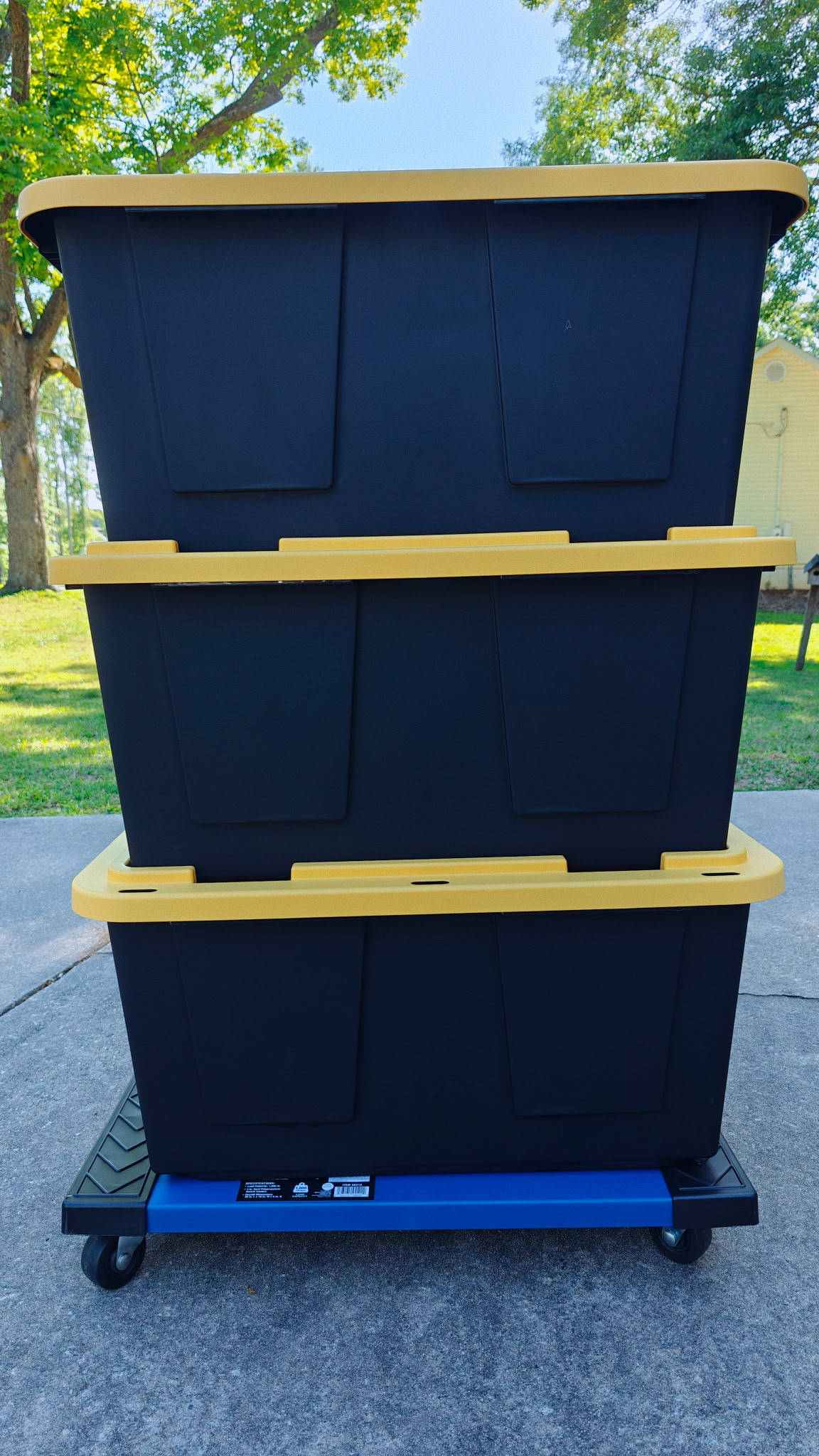 SETX Tote Rentals — heavy-duty 27-gallon totes stacked on a wheeled tote dolly